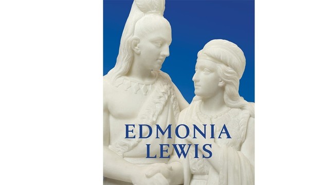 An image of the cover of the book "Edmonia Lewis: Said in Stone," featuring a close-up of a marble statue by Edmonia Lewis of two Native American people (a man and a woman) holding hands against a blue background. The words "Edmonia Lewis" appear in front of the statue in blue.
