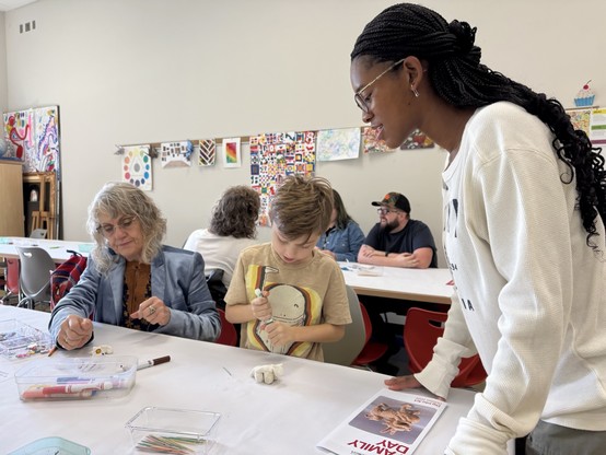 Student gallery teacher Samaya Porter leads an activity in the museum's studio classroom that involves making animals out of air-dry clay.